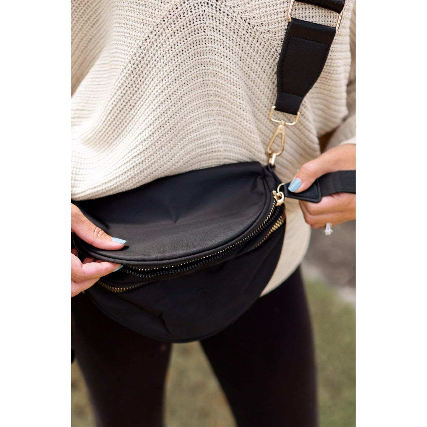 Women's sling bag with zipper closure and adjustable strap