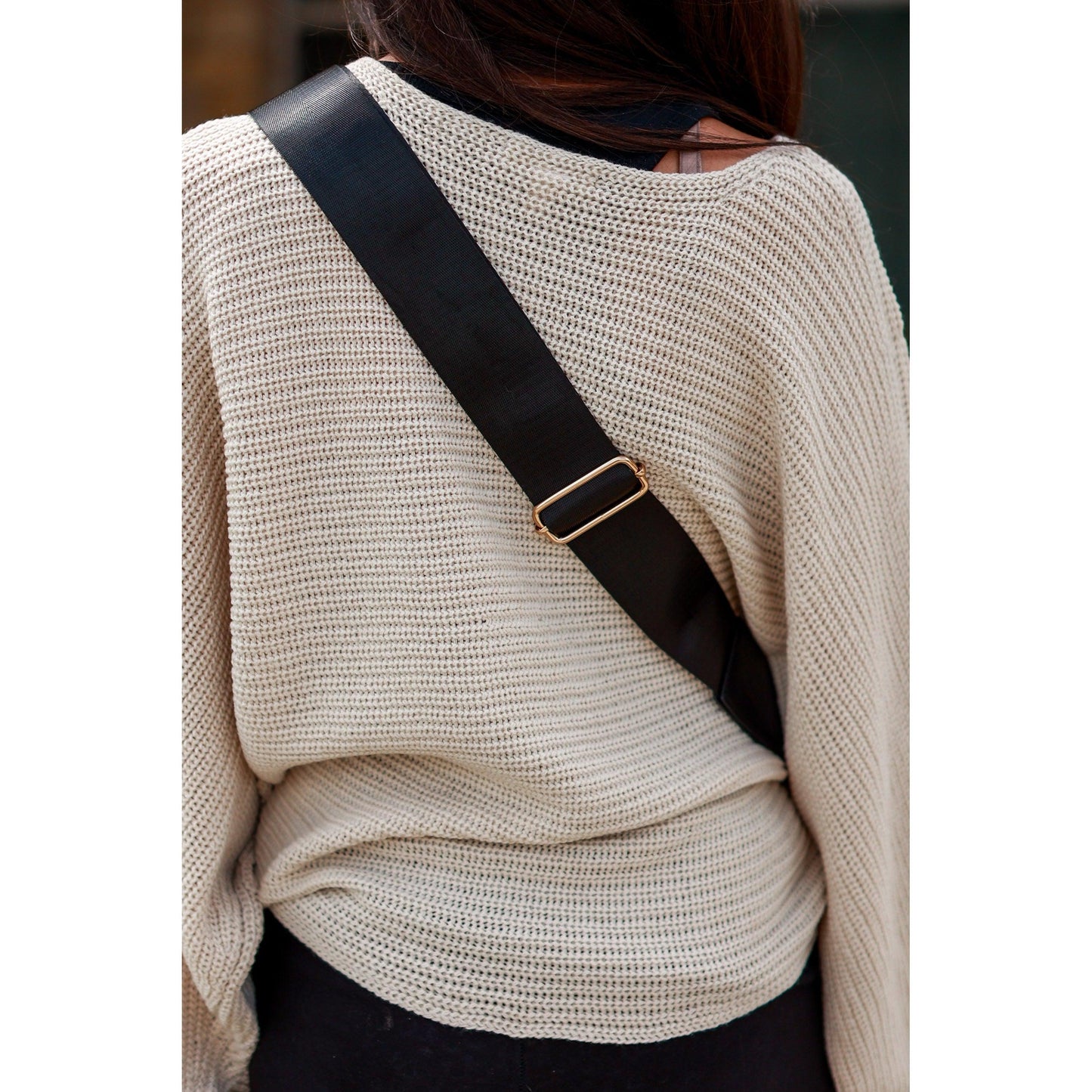 Women's sling bag with zipper closure and adjustable strap