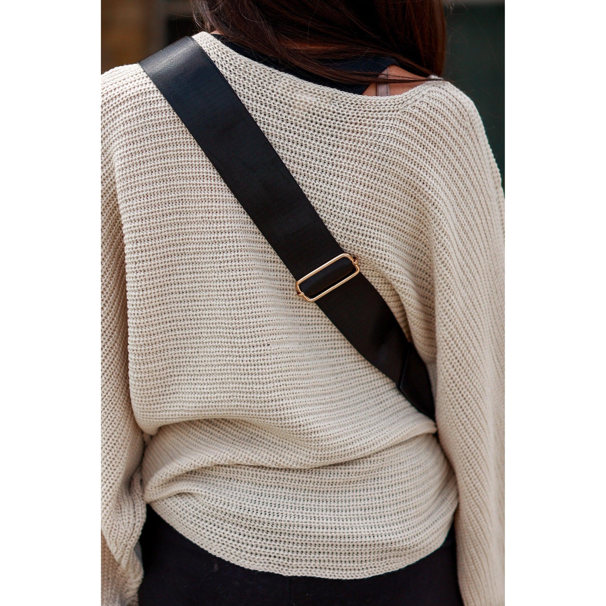 Women's sling bag with zipper closure and adjustable strap