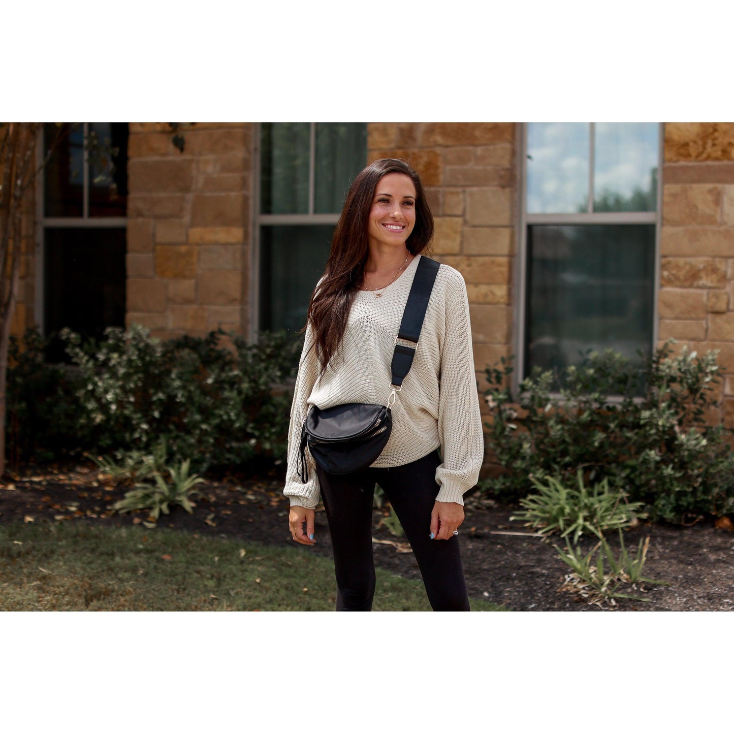 Women's sling bag with zipper closure and adjustable strap