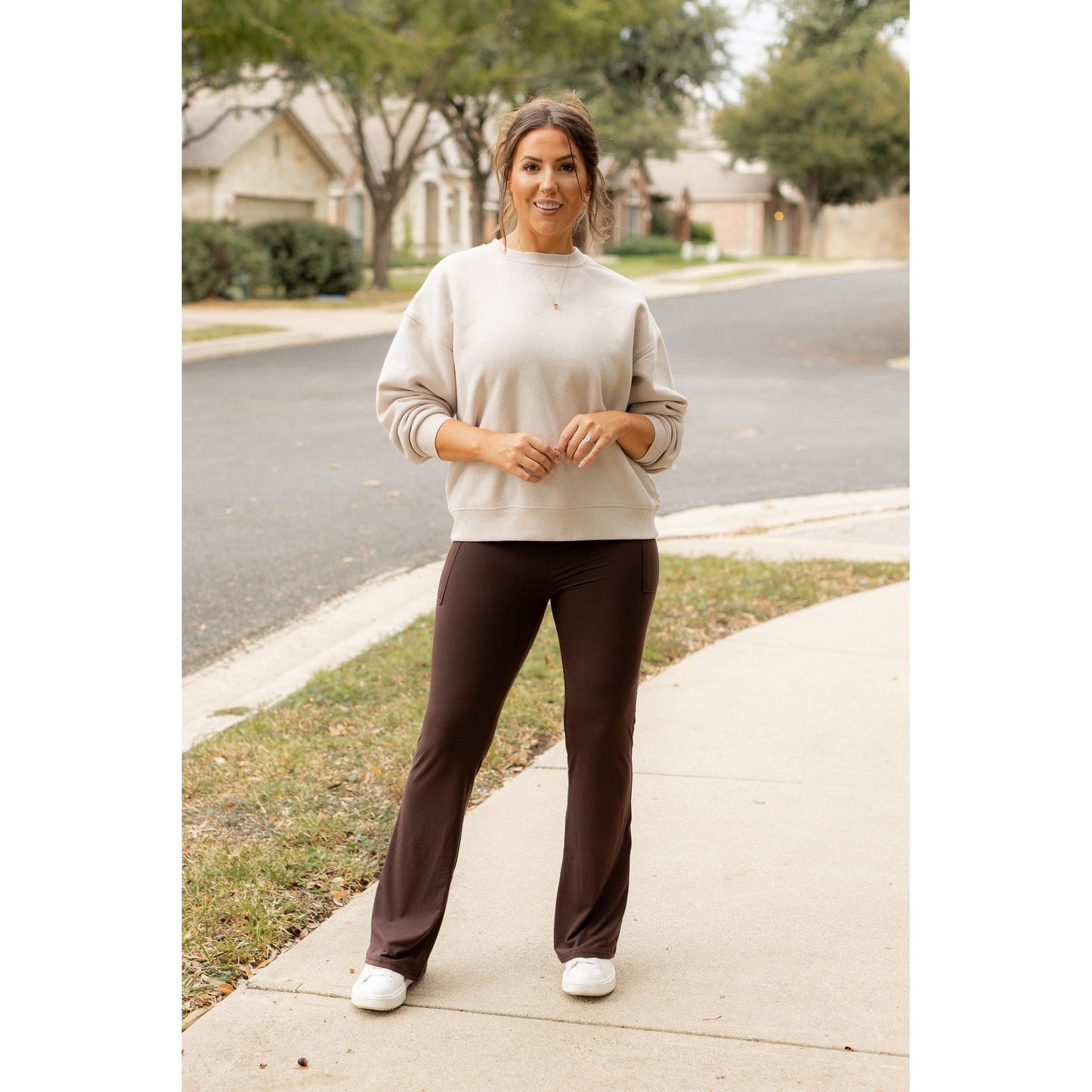 High-waisted brown bootcut leggings with pockets by Julia Rose, Julia Rose women’s brown flared leggings lifestyle image