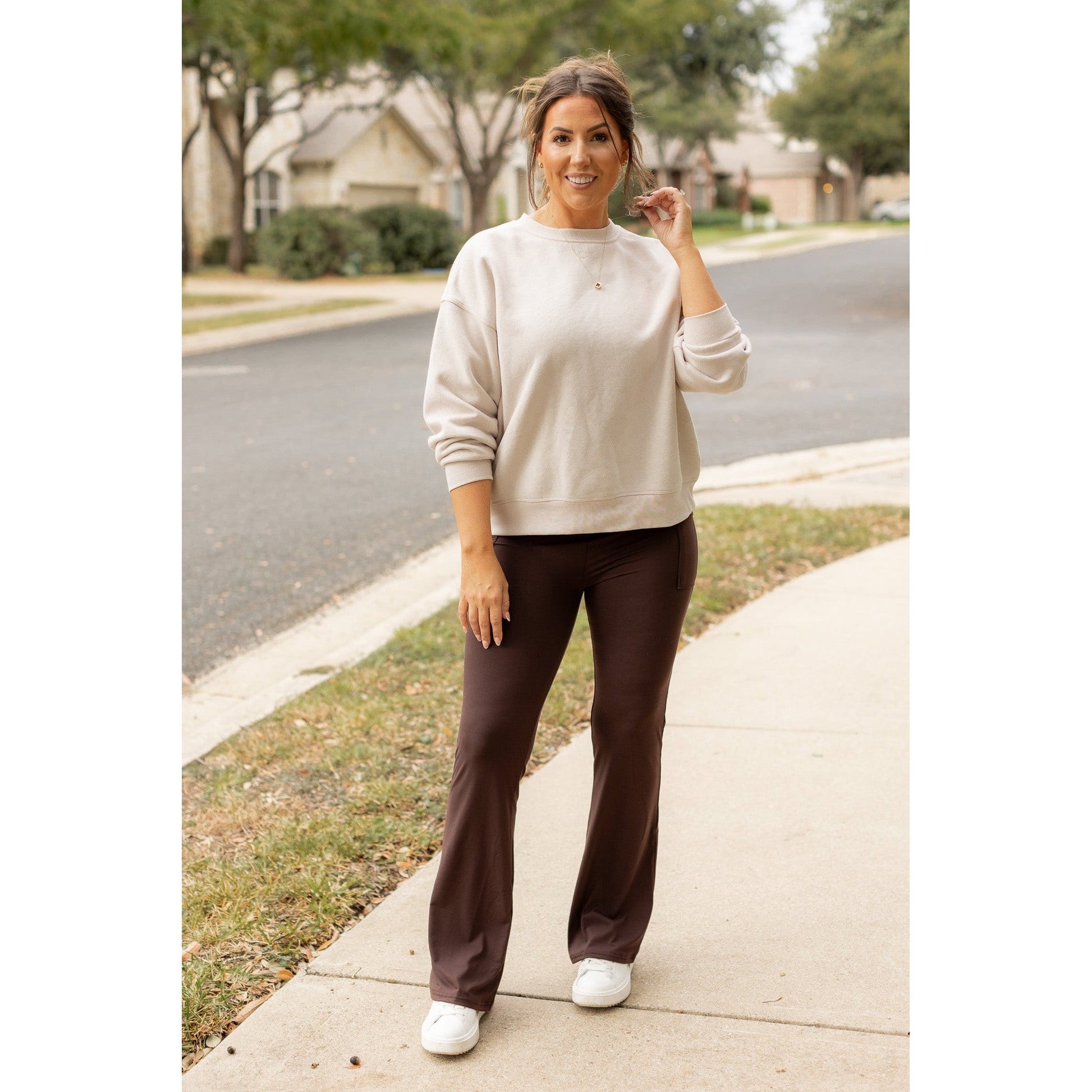 High-waisted brown bootcut leggings with pockets by Julia Rose, Julia Rose women’s brown flared leggings lifestyle image