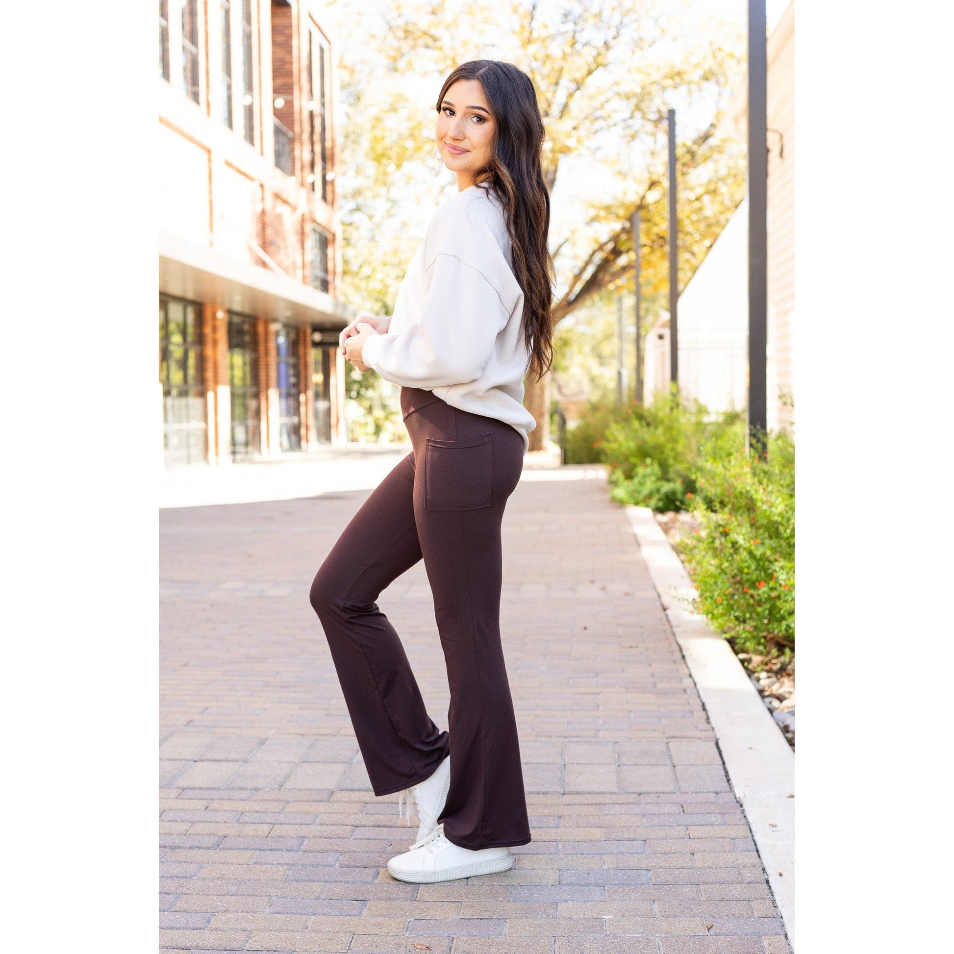High-waisted brown bootcut leggings with pockets by Julia Rose, Julia Rose women’s brown flared leggings lifestyle image
