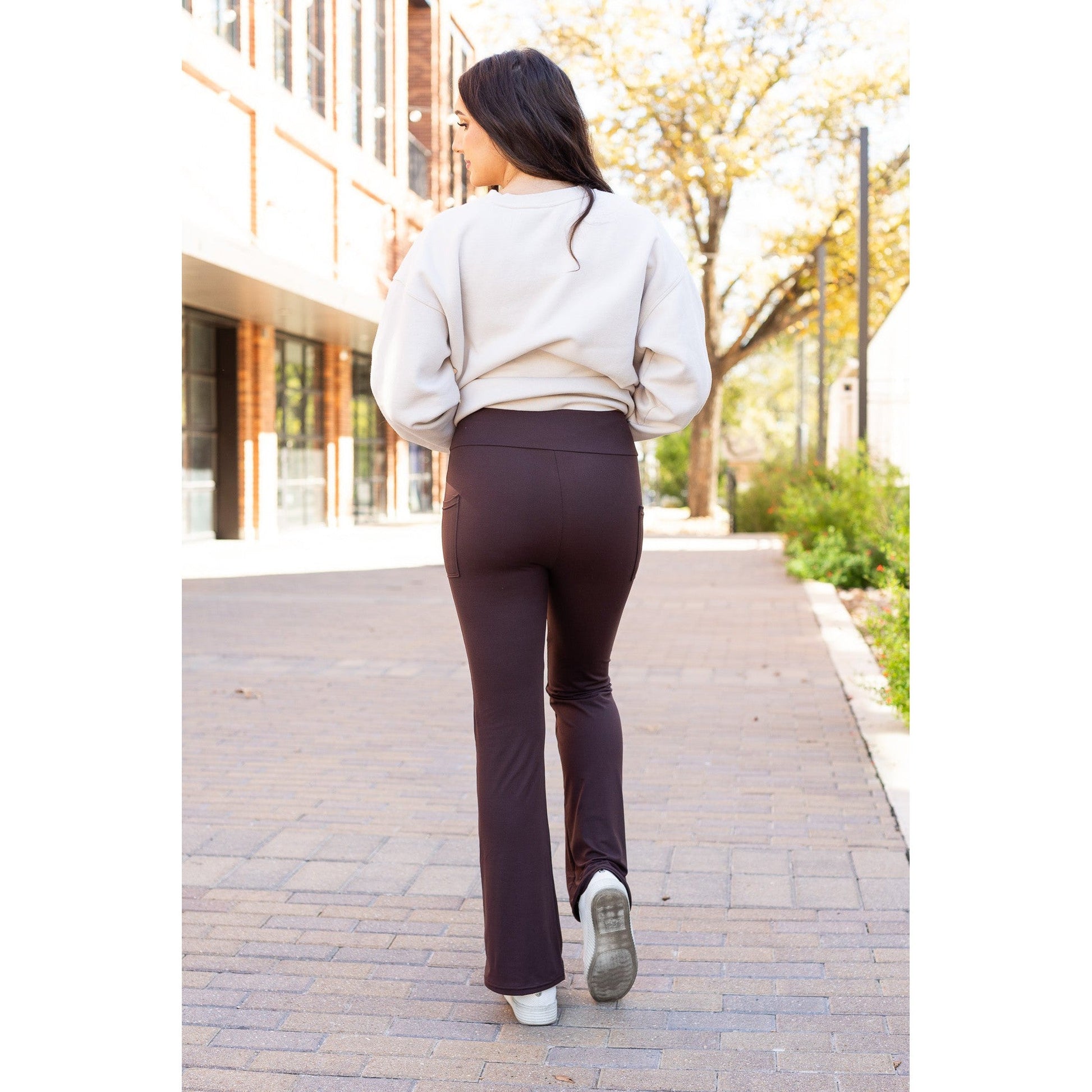 High-waisted brown bootcut leggings with pockets by Julia Rose, Julia Rose women’s brown flared leggings lifestyle image