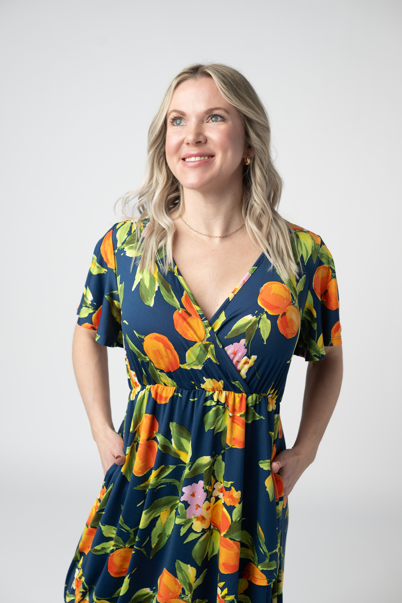 Harley Navy Citrus High Low Dress With Crossover Neckline And Pockets by Michelle Mae