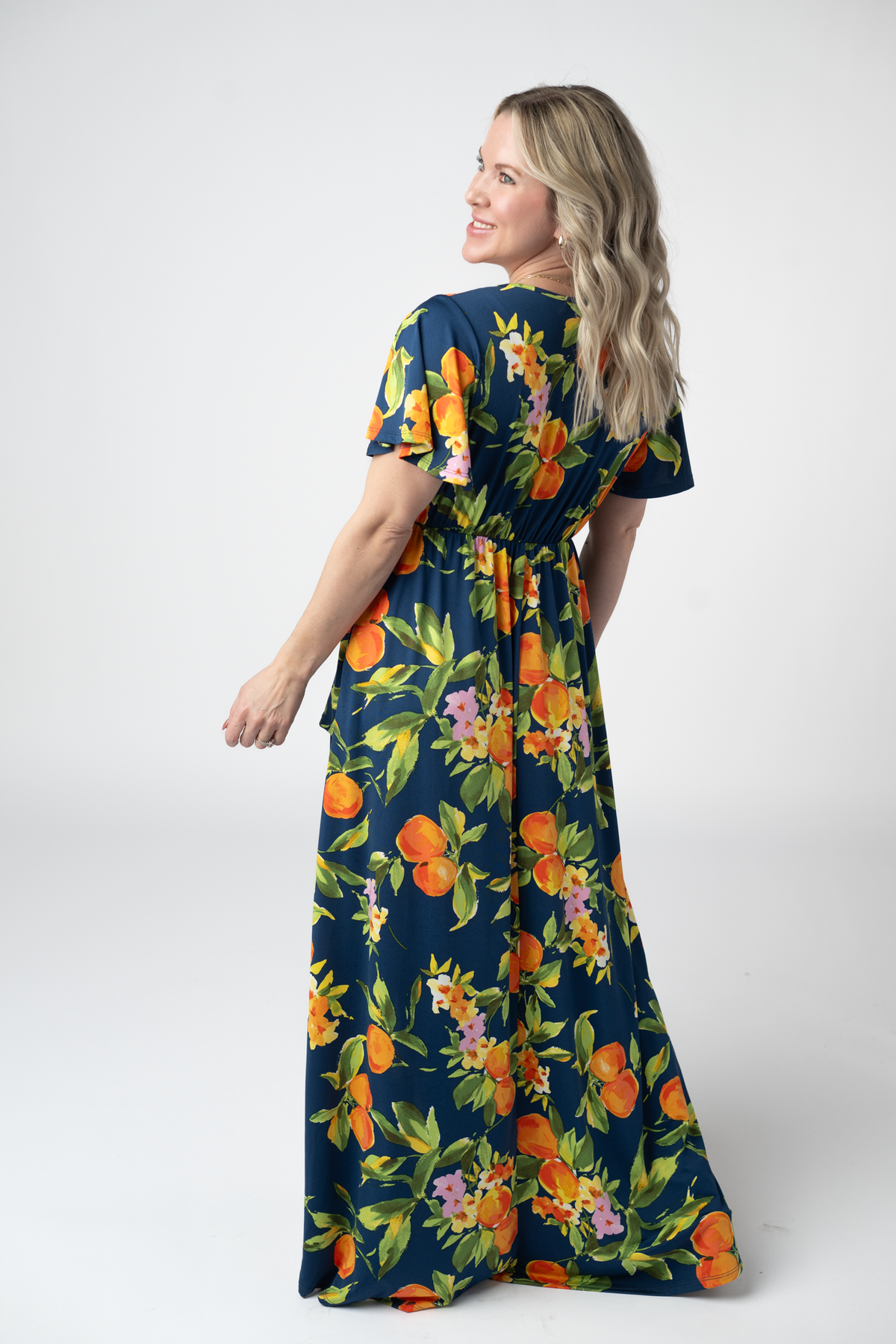 Harley Navy Citrus High Low Dress With Crossover Neckline And Pockets by Michelle Mae