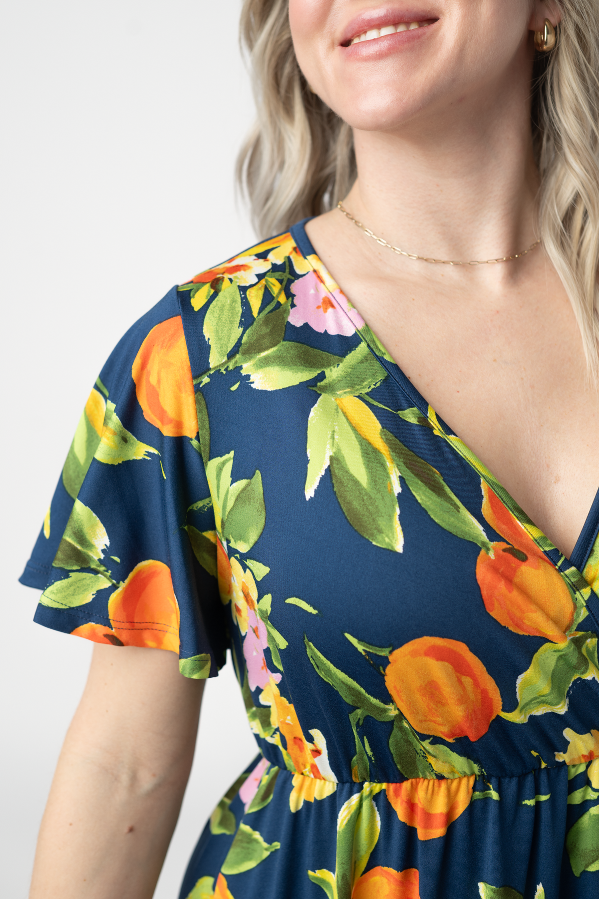 Harley Navy Citrus High Low Dress With Crossover Neckline And Pockets by Michelle Mae