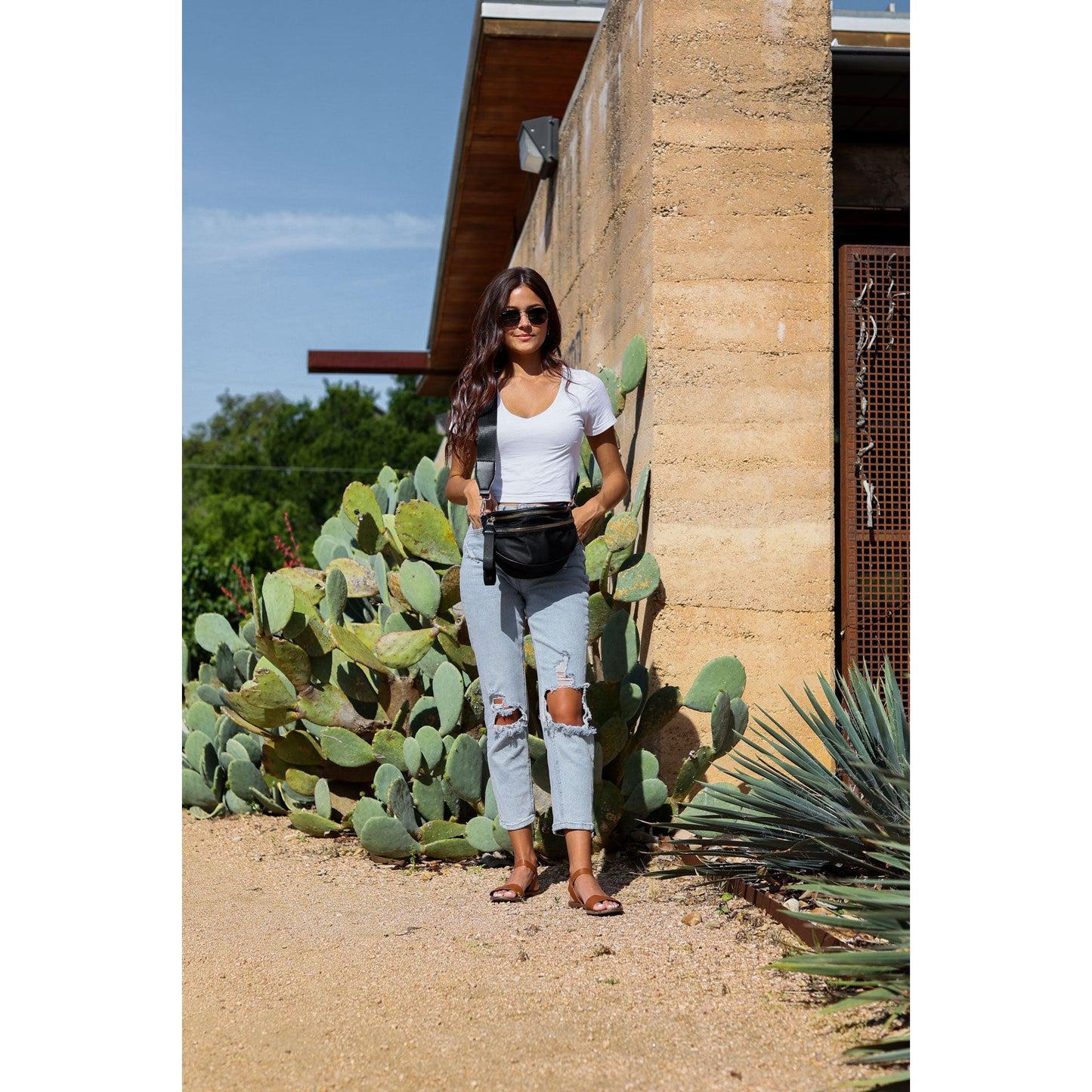 Women's sling bag with zipper closure and adjustable strap